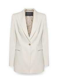 Blazer de color crema con un solo botón, solapas con muesca, bolsillos con solapa y forro interior estampado visible en el cuello.