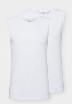 Kaks valget ilma varrukat T-särki pehmest puuvillast. Omavad ümmargust kaelust ja siledat tekstuuri; mõlemad särgid on lihtsa disainiga.