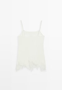 Weißes ärmelloses Top mit dünnen Trägern und gezacktem Spitzenbesatz am Saum.