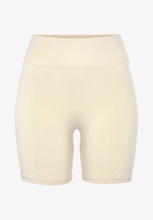 Shorts stretch beiges avec une taille côtelée, présentant une texture lisse et un motif géométrique subtil sur les côtés. Longueur mi-cuisse.