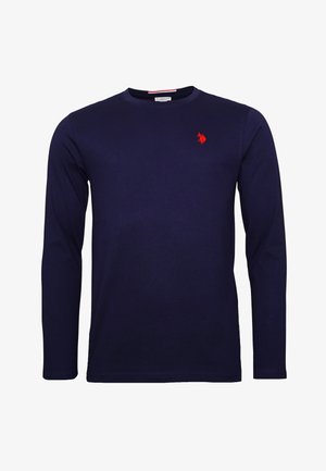 Cămășă albastră închisă cu mâneci lungi, din bumbac, având un logo roșu brodat pe partea stângă a pieptului și un guler rotund. Textură fină.