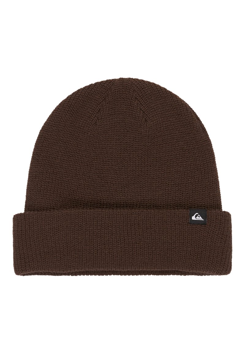 Brown knit beanie with a folded cuff, featuring a small black and white logo tag on the side. Textured fabric with a close-knit pattern.