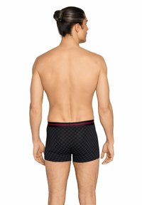 Black patterned boxer briefs featuring a fitted design, elastic waistband with red accents, and a smooth texture. View from the back.