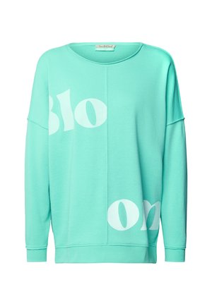Mint green sweatshirt with a loose fit, featuring large white text that says "Bloom." Soft fabric and dropped shoulder design.