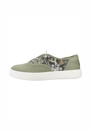 Zapatilla casual de caña baja en verde oliva con suela blanca, panel lateral de malla con estampado de palmeras y cactus, y cordones blancos.