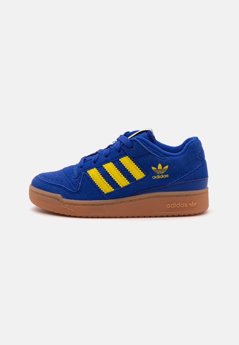 Blue suede sneaker with yellow stripes, gum rubber outsole, and silver detailing. Features a low-top design and padded collar for comfort.
