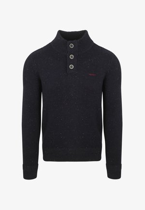 Marineblauwe sweater met een hoge geribbelde kraag, drie knopen bij de hals en een gestructureerde textuur. Strak model met geribbelde manchetten en onderrand.