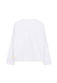 Long-sleeve white T-shirt with a round neck, made from cotton. Features a small yellow logo at the hem on the left side.