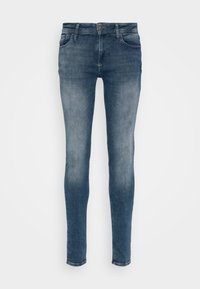 Jeans ajustados en denim azul medio con un sutil patrón desvanecido. Cuenta con cinco bolsillos, un sistema de cierre con botones y un diseño clásico de cinturilla.