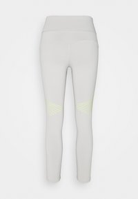 Jasnoszare legginsy z wysokim stanem, z delikatnymi żółtymi wzorami na plecach kolan.