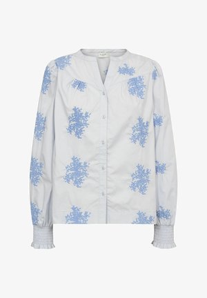 Világoskék gombos ing fehér anyagból, kék virágmintás hímzéssel és ráncolt mandzsettával. Klasszikus gallér kialakítás.