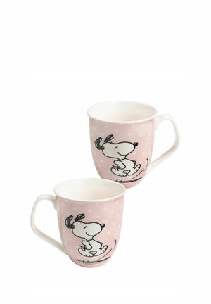 Two pink ceramic mugs with white polka dots, each featuring a black and white cartoon dog running, shown from different angles.