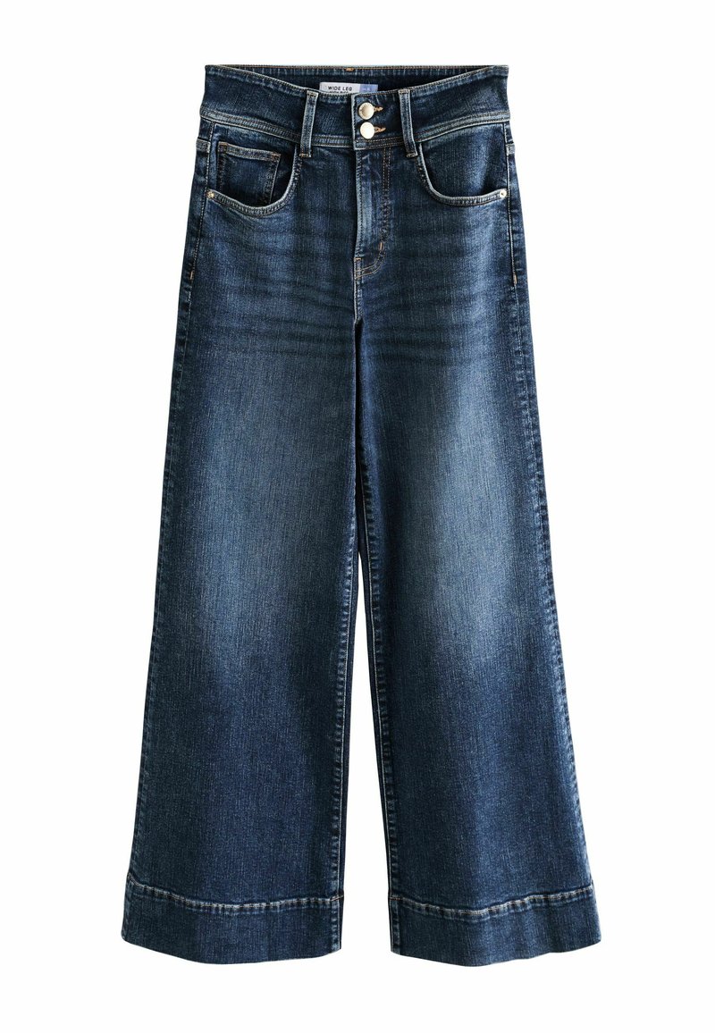 Jeans de denim de pierna ancha en azul oscuro con un acabados desgastado. Presenta cierre de doble botón, cinco bolsillos y un dobladillo remangado.
