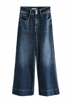 Bukser i mørkeblå denim med vide ben, forlommer, bæltestropper og dobbelt knaplukning i taljen.
