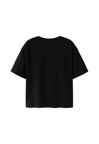 Plain black short-sleeve oversized t-shirt shown from the back on a white background.