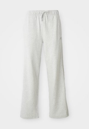 Pantaloni da sweat in cotone grigi con vestibilità rilassata, vita elastica, cordino regolabile e cuciture laterali. Design semplice senza motivi visibili.