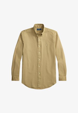 Chemise beige à manches longues avec boutons, col boutonné et petit logo brodé sur la poitrine gauche.