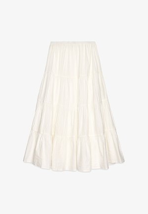 White tiered maxi skirt made of textured fabric, featuring an elastic waistband and a flowing silhouette with multiple ruffles.