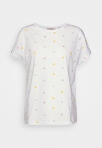 Vit t-shirt med korta ärmar, prydd med ett prickigt mönster i gult, rosa och blått. Mjuk bomullsmaterial, avslappnad passform.