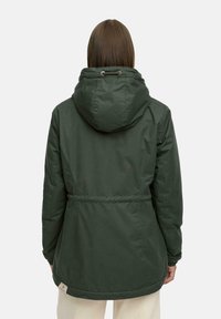 Green hooded jacket made of smooth fabric, featuring a cinched waist, elastic cuffs, and a small logo tag near the hem.
