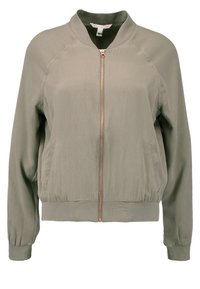 Veste bomber vert olive clair avec fermeture éclair à l'avant, col, poignets et ceinture côtelés, et poches latérales.
