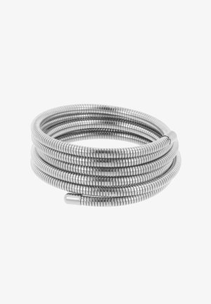 Srebrna, elastyczna metalowa spiralna spirala ułożona w kształt koła. Posiada małe, równomiernie rozmieszczone segmenty o gładkiej, refleksyjnej teksturze.