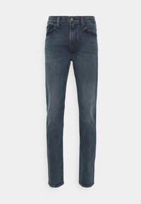 Denimjeans i mörk tvätt med rak ben-design, femficksstil och klassisk knappstängning. Har subtil blekning och sömnadsdetaljer.