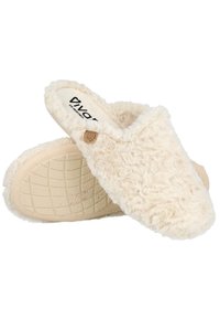 Zapatillas ligeras de color beige con un suave exterior de pelo, una plantilla acolchada y una suela de goma texturizada con un patrón de diamantes.