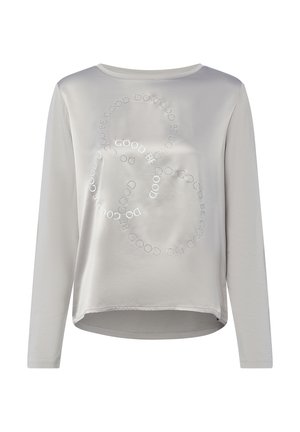 Light gray long-sleeve shirt with a rounded neckline, featuring a circular pattern of the word "GOOD" in silver accents across the front.