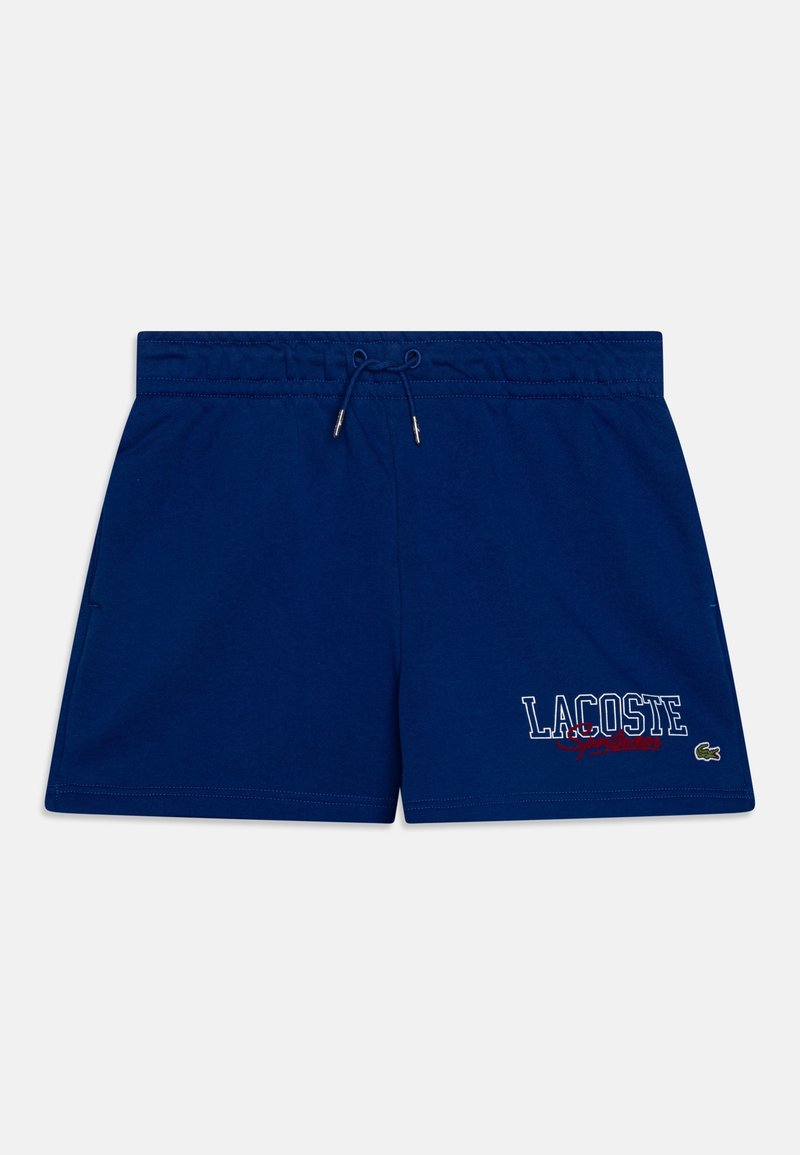 Námořnické modré plavkové šortky s elastickým pasem, šňůrkou, bočními kapsami a bílým/červeným potiskem loga "LACOSTE" na nohavici.
