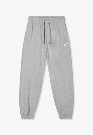 Pantalons de survêtement gris en tissu doux, dotés d'une taille élastique avec cordon de serrage, de chevilles resserrées et d'un petit logo en patch.
