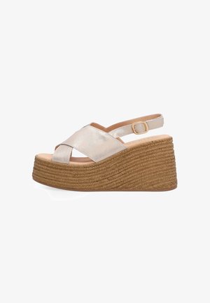 Wedge sandal with metallic crossed straps, ankle buckle, and rope-textured platform sole in light brown.