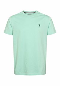 Svetlo mätovo zelené bavlnené tričko s krátkymi rukávmi a okrúhlym výstrihom, so malým tmavozeleným logom na ľavej strane hrude. Hladká textúra.