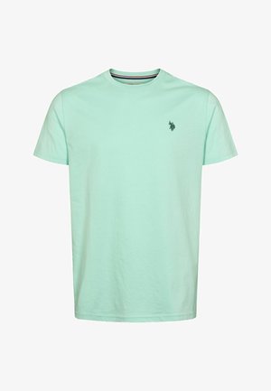 T-shirt en coton vert menthe clair à col rond et manches courtes, avec un petit logo vert foncé sur la poitrine gauche. Texture lisse.