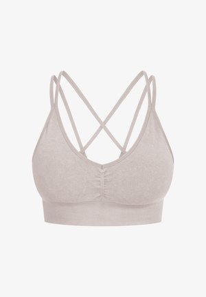Bralette de color beige claro con una textura suave, que presenta tirantes entrecruzados en la parte posterior y una banda inferior acanalada cómoda.