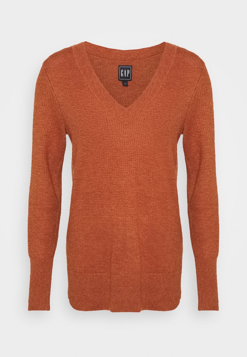 Pull à col en V en tissu tricoté texturé orange. Présente des manches longues et une coupe décontractée avec des poignets et un ourlet côtelés.