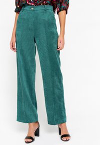 Unselected, green emerald