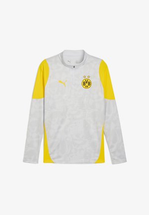 Maglietta sportiva a maniche lunghe grigia con dettagli gialli. Presenta un colletto con mezza zip, logo Puma ed emblema del club Borussia Dortmund. Tessuto strutturato.