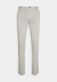 Helle beige Hosen in einem schlanken Design, aus glattem Baumwollstoff. Mit Knopfverschluss, Gürtelschlaufen und geradem Bein geschnitten.