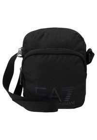 Borsa a tracolla nera in nylon con chiusura a zip, tracolla regolabile e dettaglio con logo sul davanti. Presenta una superficie liscia e una forma compatta.