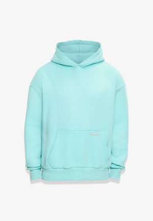 Heledad hall sinine kapuutsiga, pehmest kangast, millel on tasku ja eraldi tõmbluku kinnitus kapuutsi juures. Varrukate ja altääre juures on soonikuga viimistlus. Taskul on väike silt.