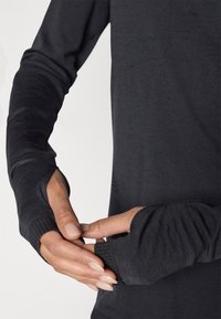 ASICS ROAD WINTER SEAMLESS TOP - Pitkähihainen paita - performance black