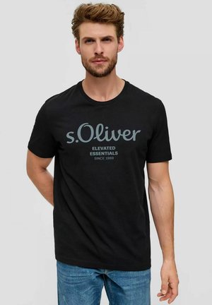 Black cotton t-shirt featuring a round neck and short sleeves, displaying a grey printed logo and text on the front. Casual fit.