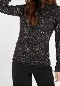 Top nero a maniche lunghe con un motivo macchiato in tonalità di rosa, blu e bianco, con colletto a zip a un quarto e design aderente.