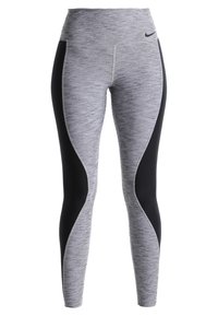 Szare i czarne legginsy sportowe z wysokim stanem, z ergonomicznymi panelami i teksturowanym wykończeniem, zapewniającym elastyczność i komfort.