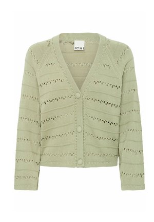 Cardigan en tricot de couleur vert clair, avec un col en V, cinq boutons et un motif ajouré avec des lignes horizontales et des découpes circulaires.