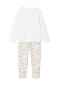 Two-piece children's outfit featuring a solid white long-sleeve top and floral-printed pants with pink, yellow, and green patterns on a white background.