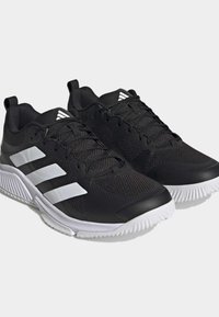 Black athletic shoes with mesh upper, white three-stripe design, flat laces, padded collar, and textured white outsole.