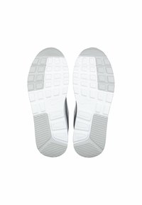 Scarpe da ginnastica Nike con suola in gomma con motivo a esagoni. Tomaia grigio scuro con dettagli e logo bianchi.