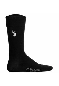 Sort bomuldsstrømpe med ribbet manchette, der har et hvidt polo-spillerlogo og tekst fra U.S. Polo Assn. nær tåen. Glat tekstur hele vejen igennem.